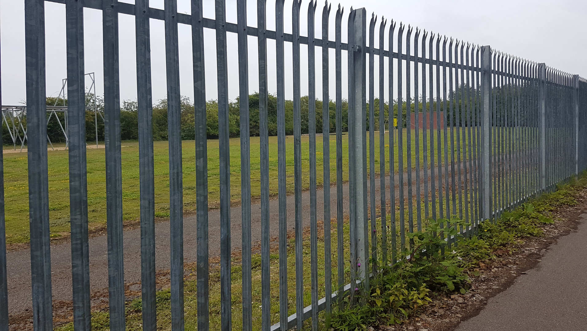 Image: A fence resembling the prison that Rustaceans have to live inside when visiting the browser.